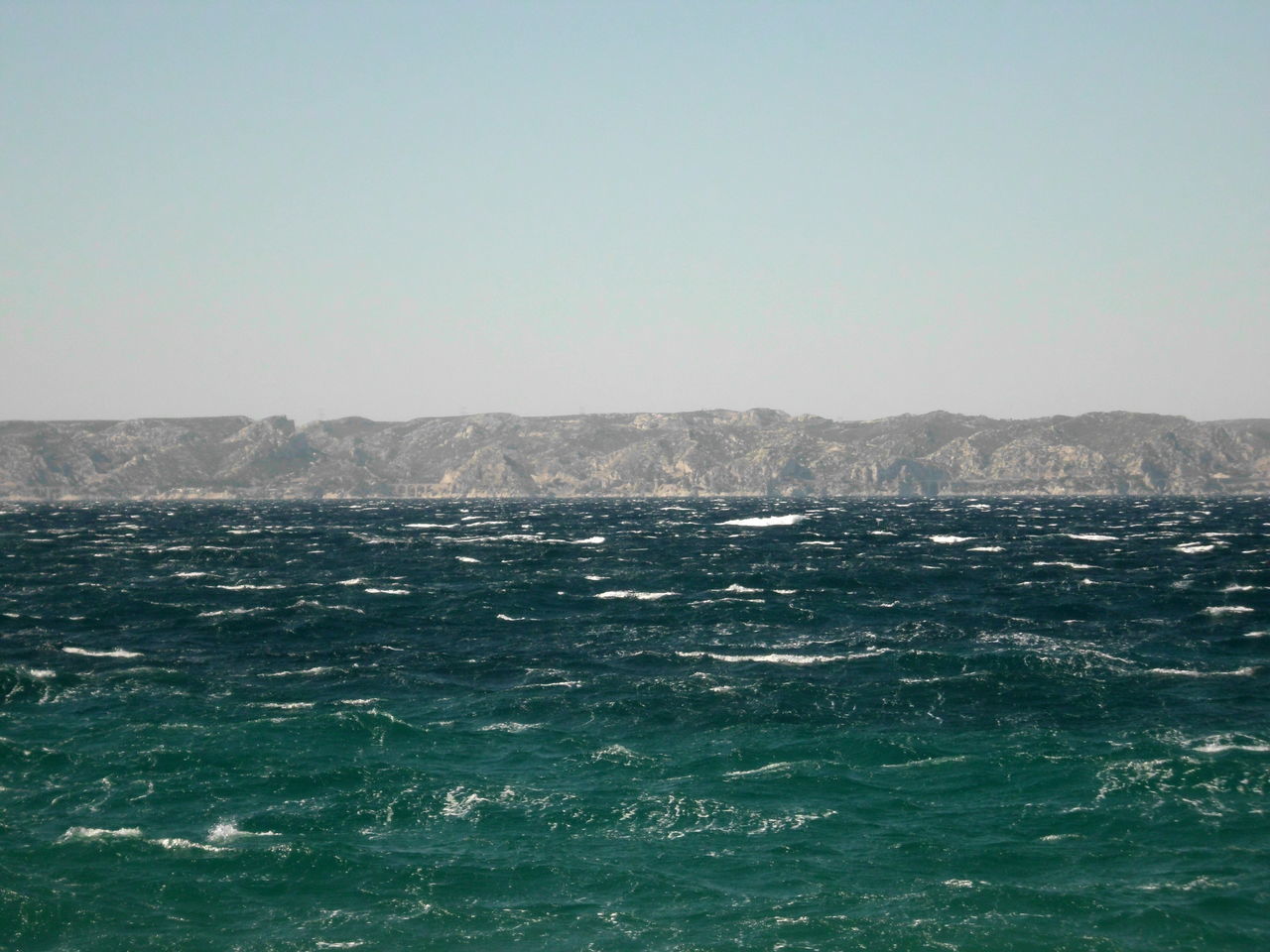 SEA AGAINST CLEAR SKY