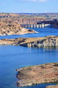 Scenic view of lake powell against blue sky