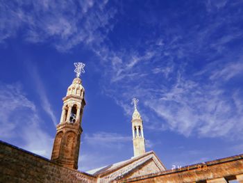 Low angle view of building against blue sky