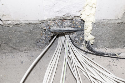 Layed installation of electric cables on the floor in a newly built house. cables passing through