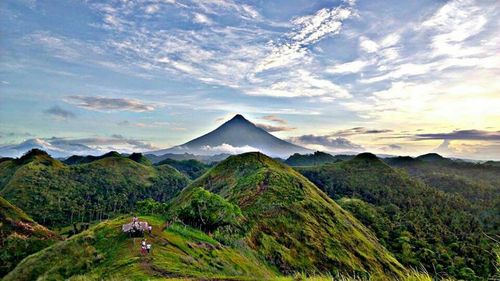 Scenic view of mountains against cloudy sky