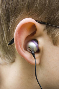 Close-up side view of man wearing headphones