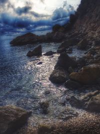 Scenic view of sea against dramatic sky