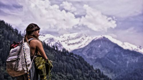 Rear view of woman looking at mountains