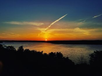 Scenic view of sunset over river