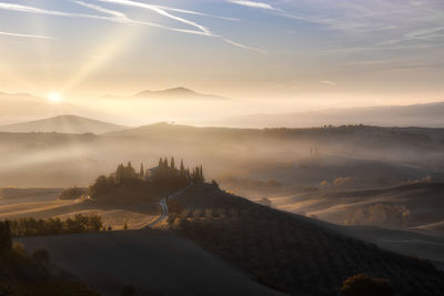 Scenic view of mountains against sky during sunset