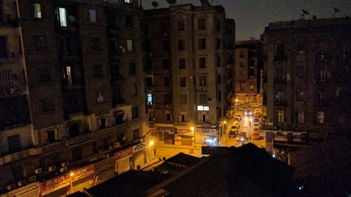 High angle view of illuminated buildings in city at night