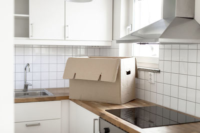 Cardboard box on kitchen worktop