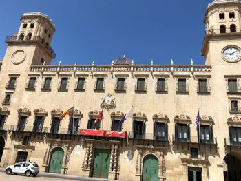 Low angle view of building against blue sky