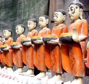 Close-up of buddha statue in row