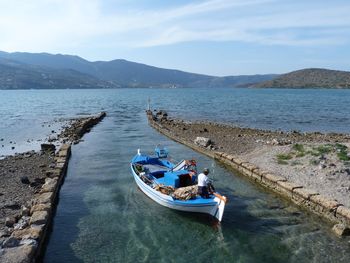 High angle view of man sailing boat in lake