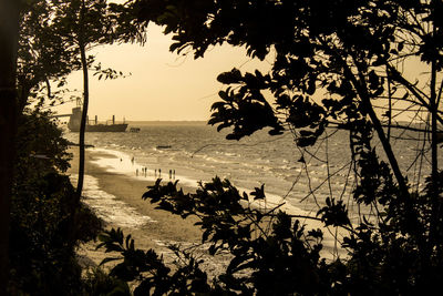 Scenic view of beach against sky during sunset