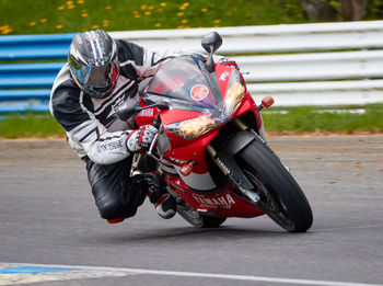 Man riding motorcycle on road