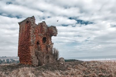 View of historical building against cloudy sky