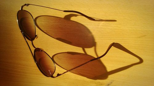 Close-up of sunglasses on table