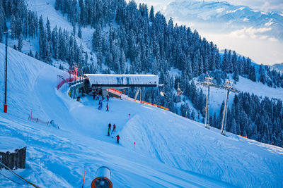 People skiing on snowcapped mountain