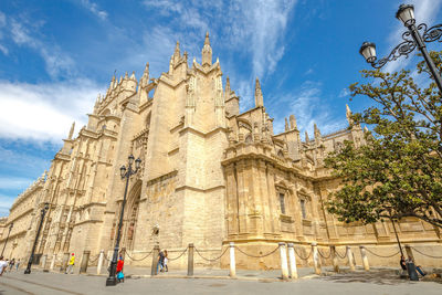 Low angle view of historic cathedral against sky