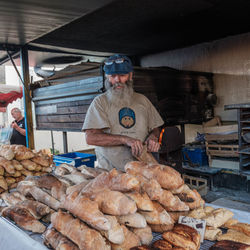 Man preparing food for sale at market