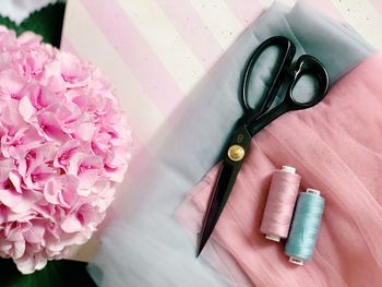 High angle view of pink flower on table