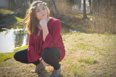 Young woman sitting on grass