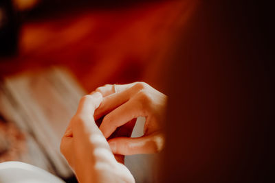 Close-up of woman hand on finger