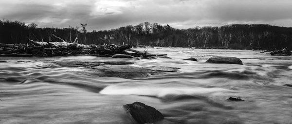 Scenic view of sea against sky during winter