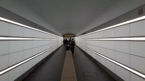 Full length of woman walking in tunnel