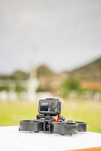 Close-up of camera on table