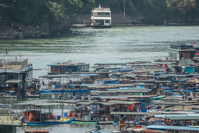 A huge amount of small boats on a river in china. the boats are mainly used for fishing 