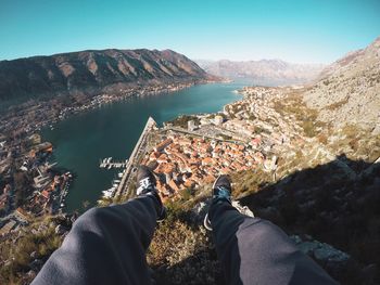 Midsection of man on mountain against sky