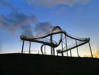 Low angle view of illuminated tiger and turtle against sky