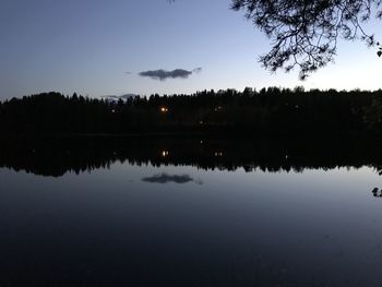 Scenic view of lake against sky at night