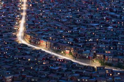 High angle view of illuminated cityscape at night