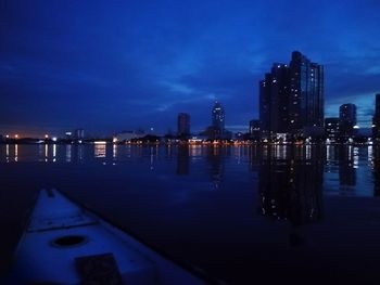 Illuminated city at waterfront