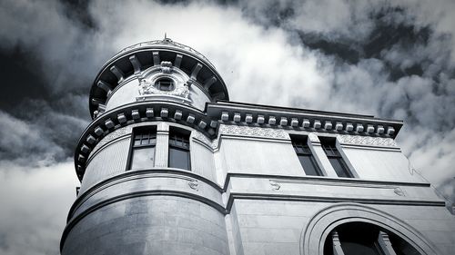 Low angle view of building against cloudy sky