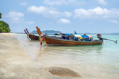 Boat in sea against sky