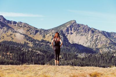 Woman standing on mountain landscape