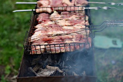 Close-up of meat on barbecue grill