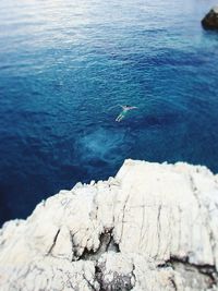 High angle view of rocks in sea