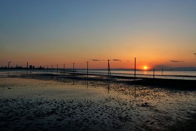 Scenic view of beach against sky during sunset