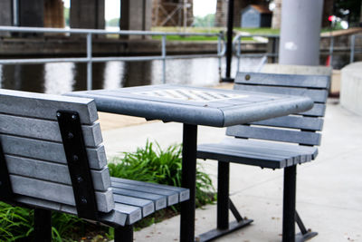 Empty chairs and table at outdoors cafe