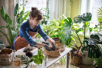 Side view of boy gardening at home