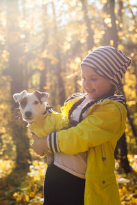 Rear view of woman with dog