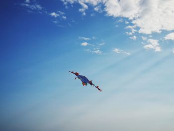 Low angle view of kite flying in sky