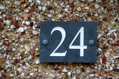 House number 24 on a brick wall in london