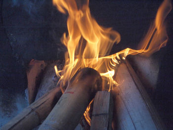 Close-up of fire burning at night