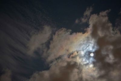 Low angle view of dramatic sky at night