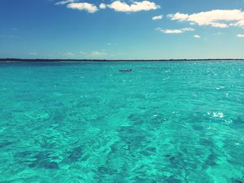 Scenic view of sea against blue sky