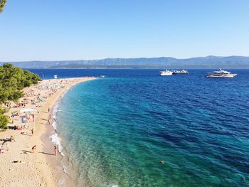 Scenic view of sea against clear blue sky