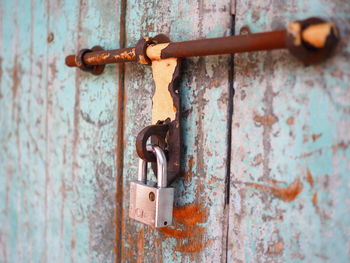 Close-up of padlock on wooden door